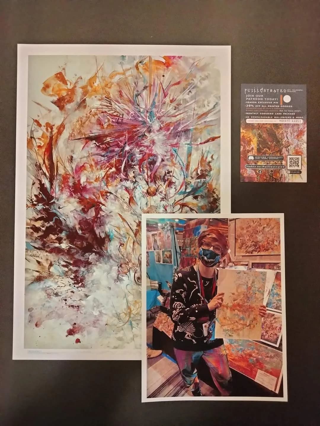 An abstract art print displayed beside a photo of its artist