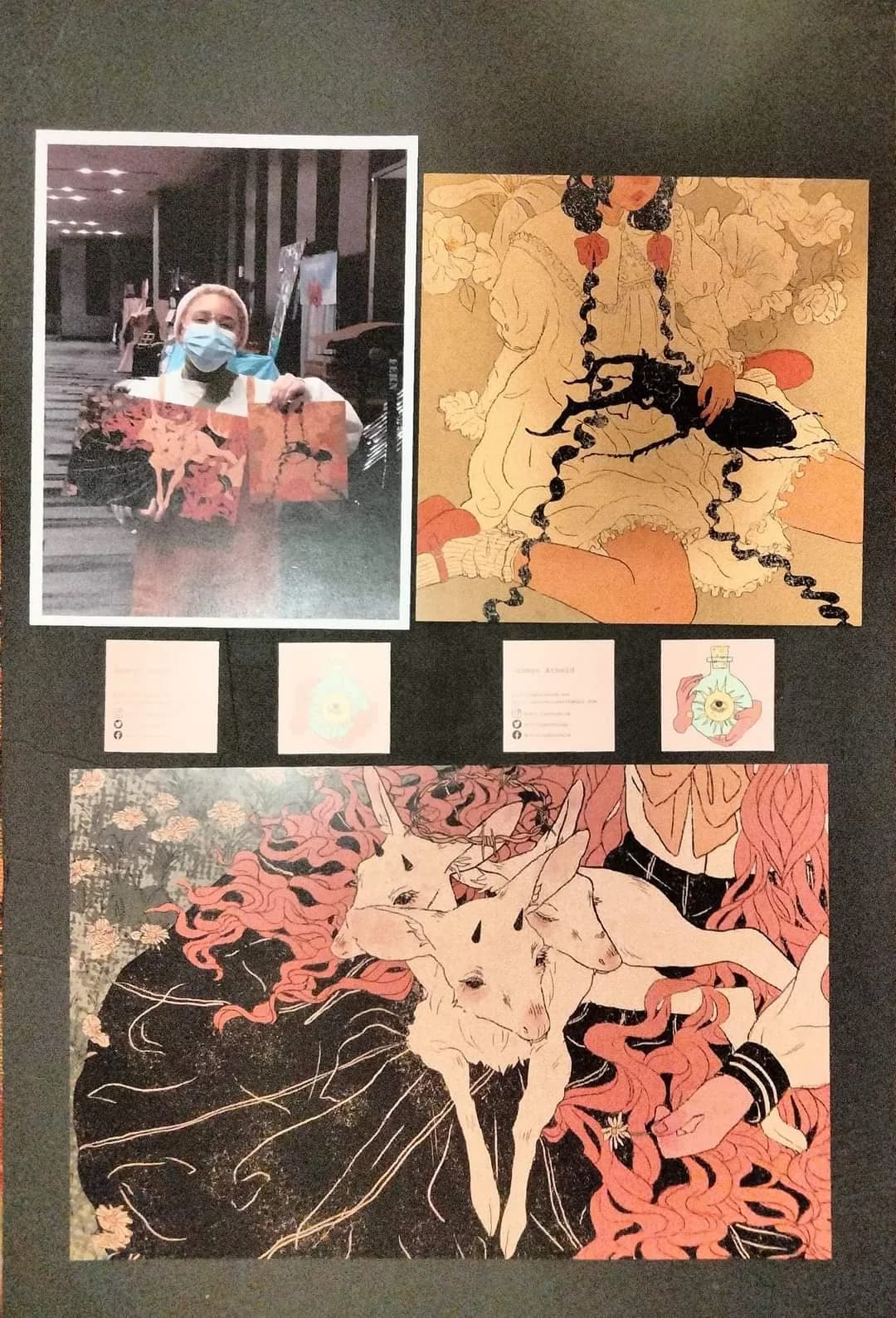 A display of illustrated prints and a photo from a past Matsuricon charity auction