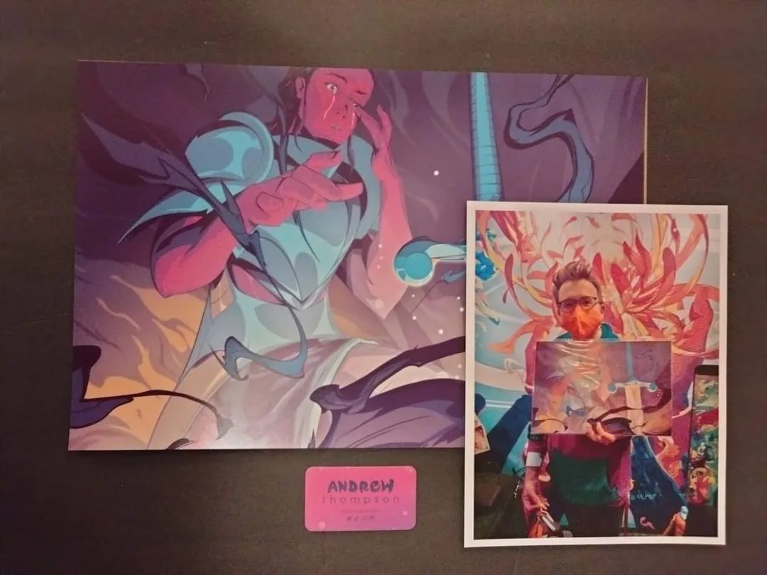 A signed fantasy illustration displayed with a photo of its artist