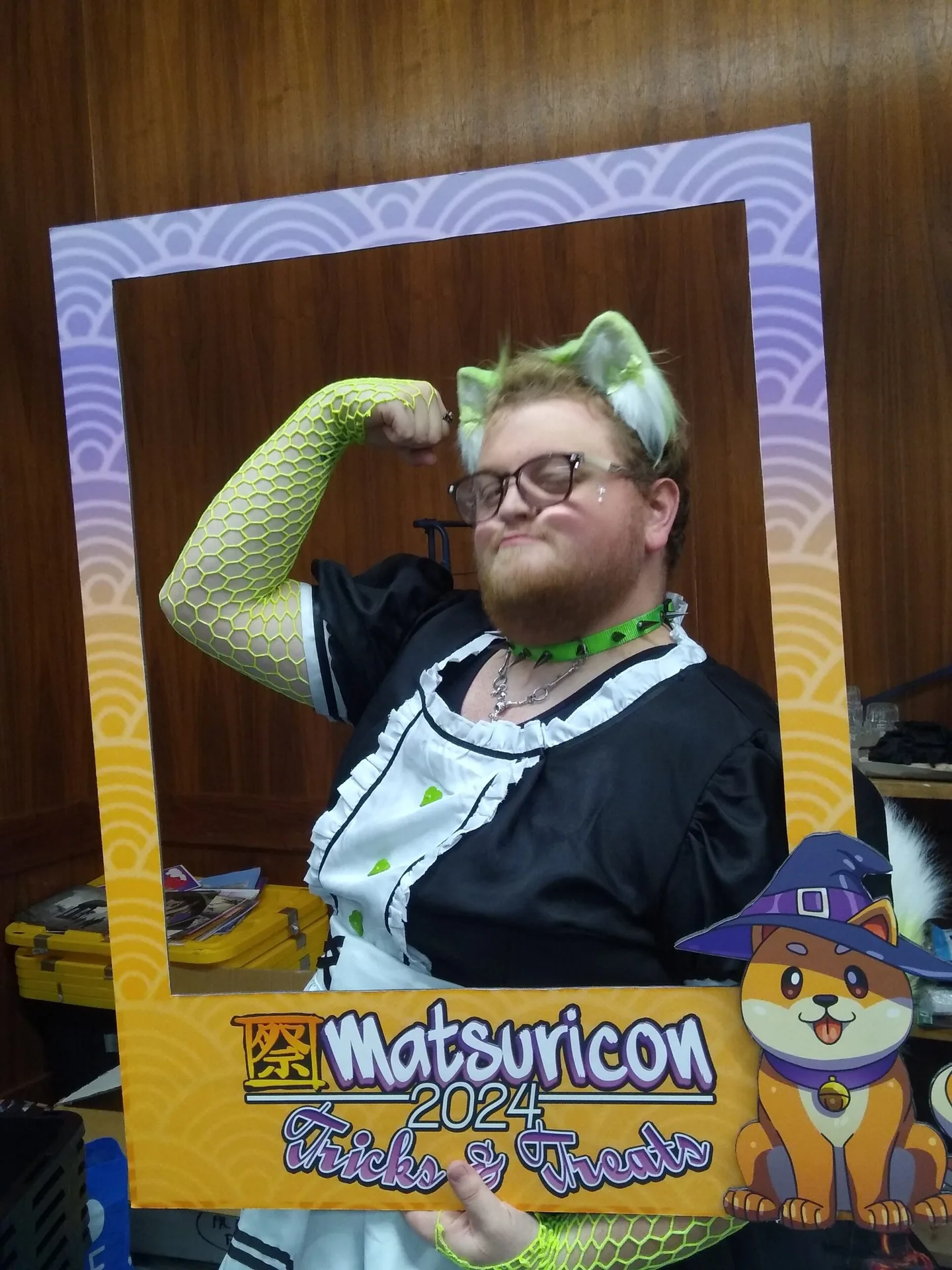 An attendee posing in the Matsuricon 2024 Tricks and Treats photo frame