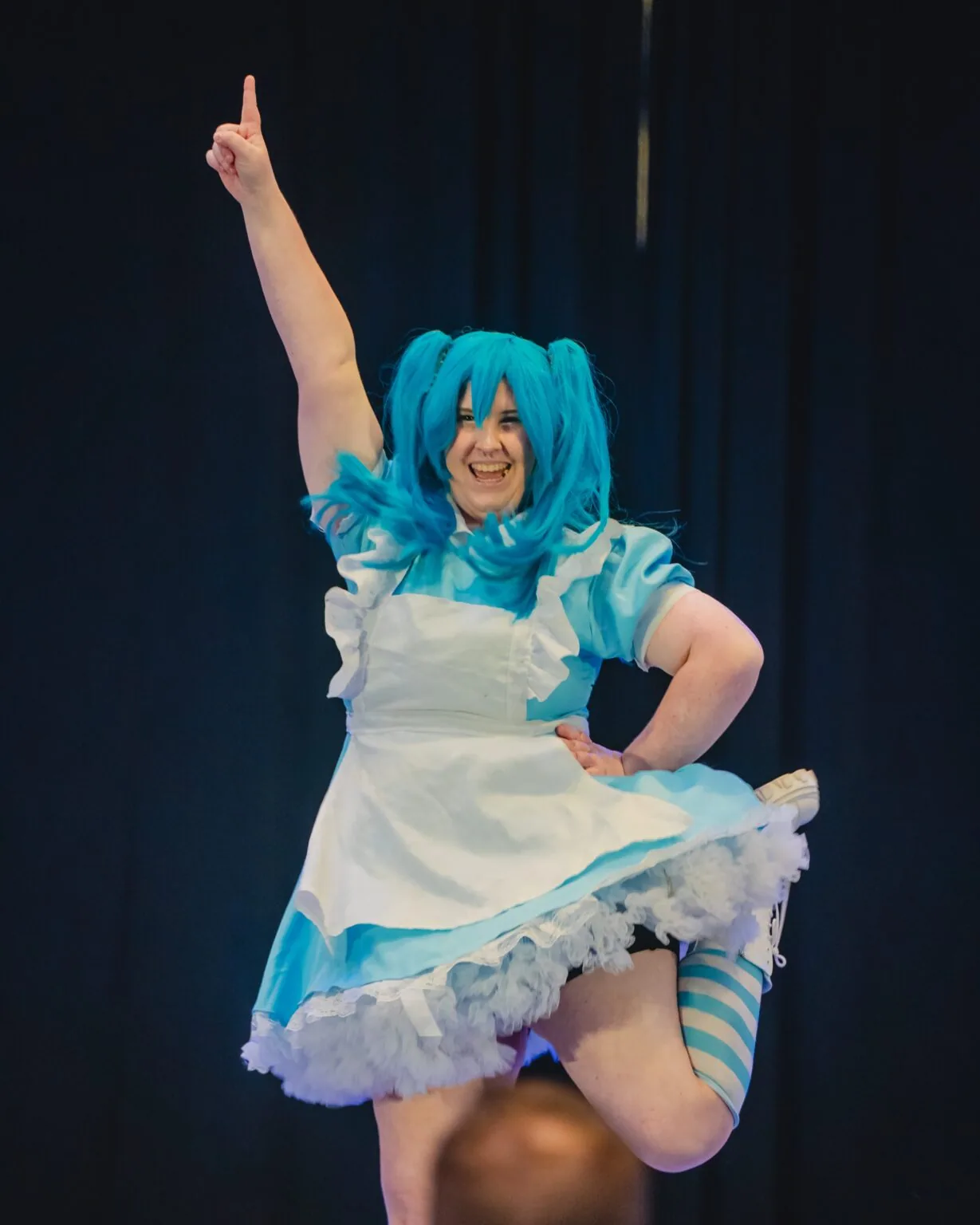 A costumed performer under the lights of the Matsuricon Main Events stage.